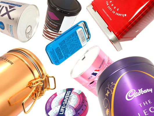 Tins of various types that open in unique ways sit next to each other.