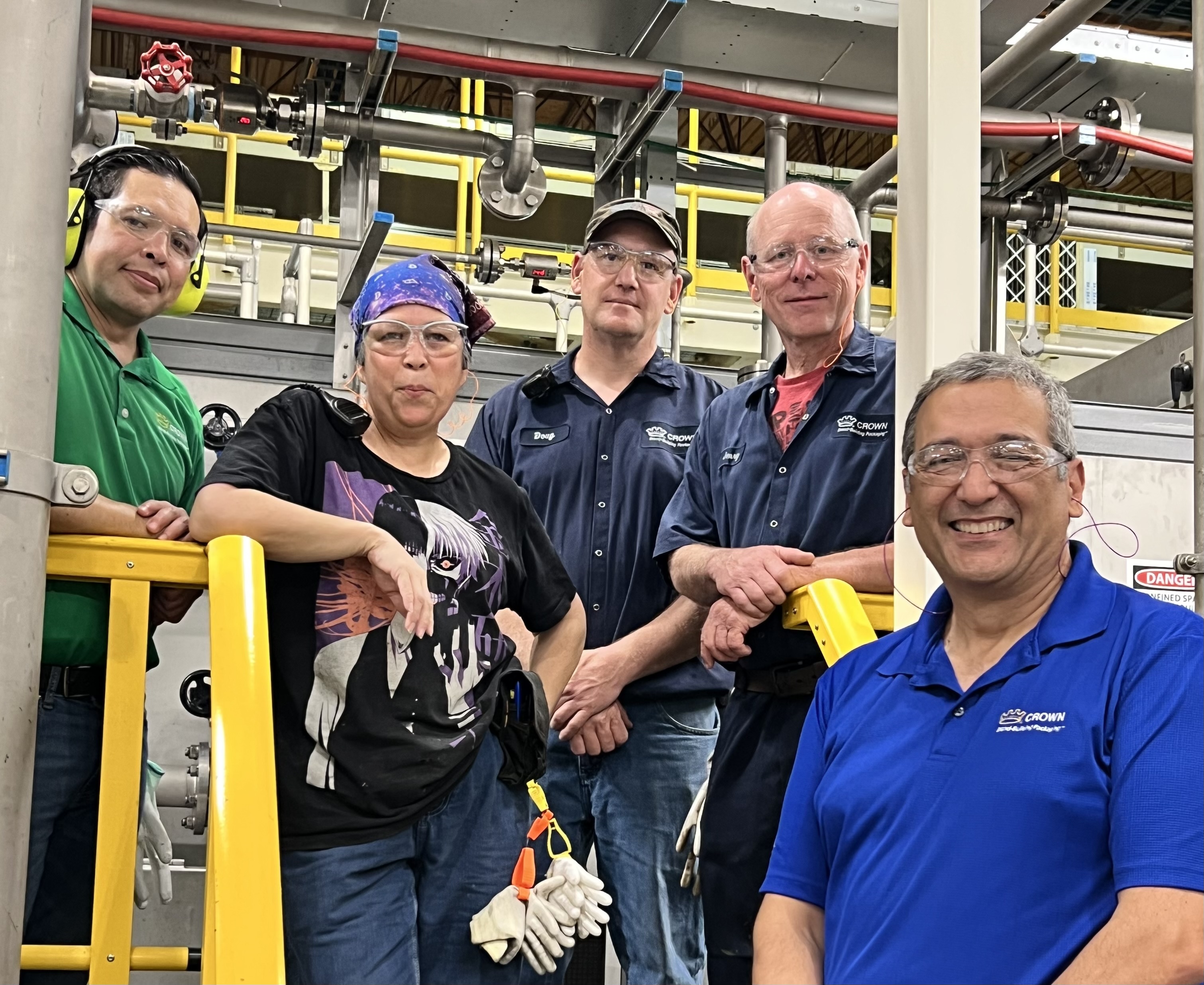 Group of Crown employees smiling at camera