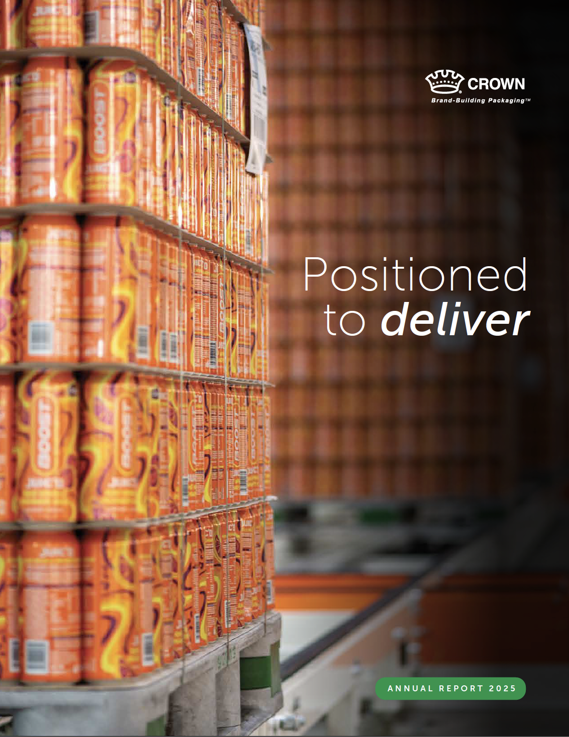 Stacks of bright orange beverage cans on pallets in a production facility, with the Crown logo and the text “Positioned to deliver” and “Annual Report 2025” overlaid on the image.