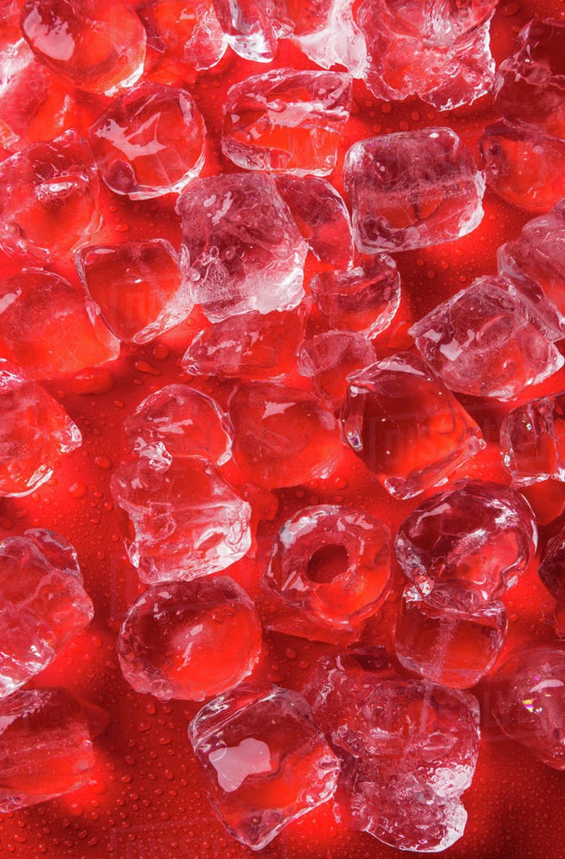 Picture of ice cubes over a red background.