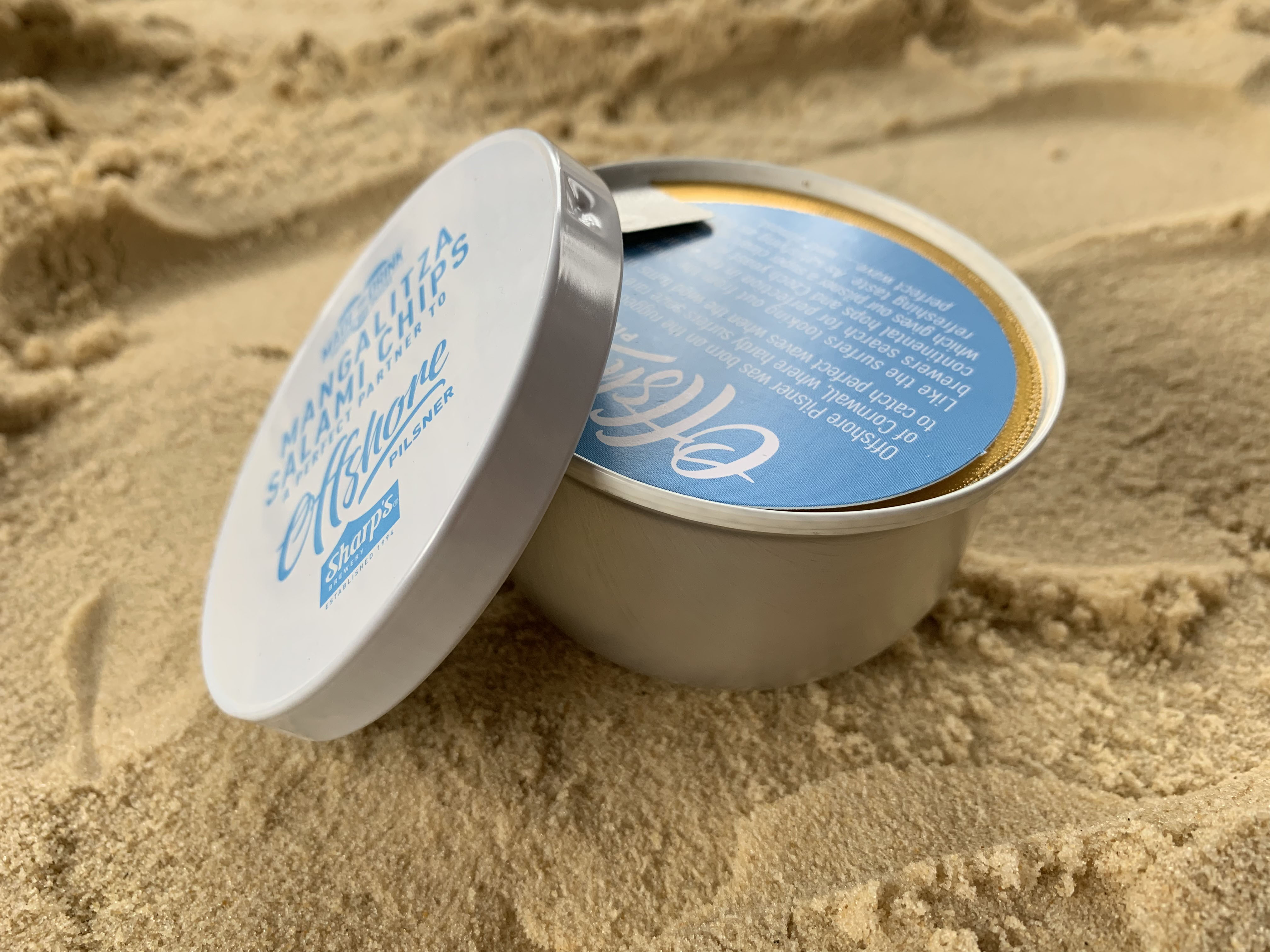 Blue and silver beverage tin