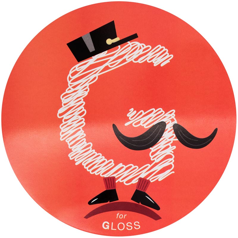 gloss-2x.jpeg A gloss finish, with a capital "G" scribbled in white ink against a glossy red background. The "G" has been depicted to be wearing a short conductors hat and cute little dress shoes, while sporting a fancy mustache.