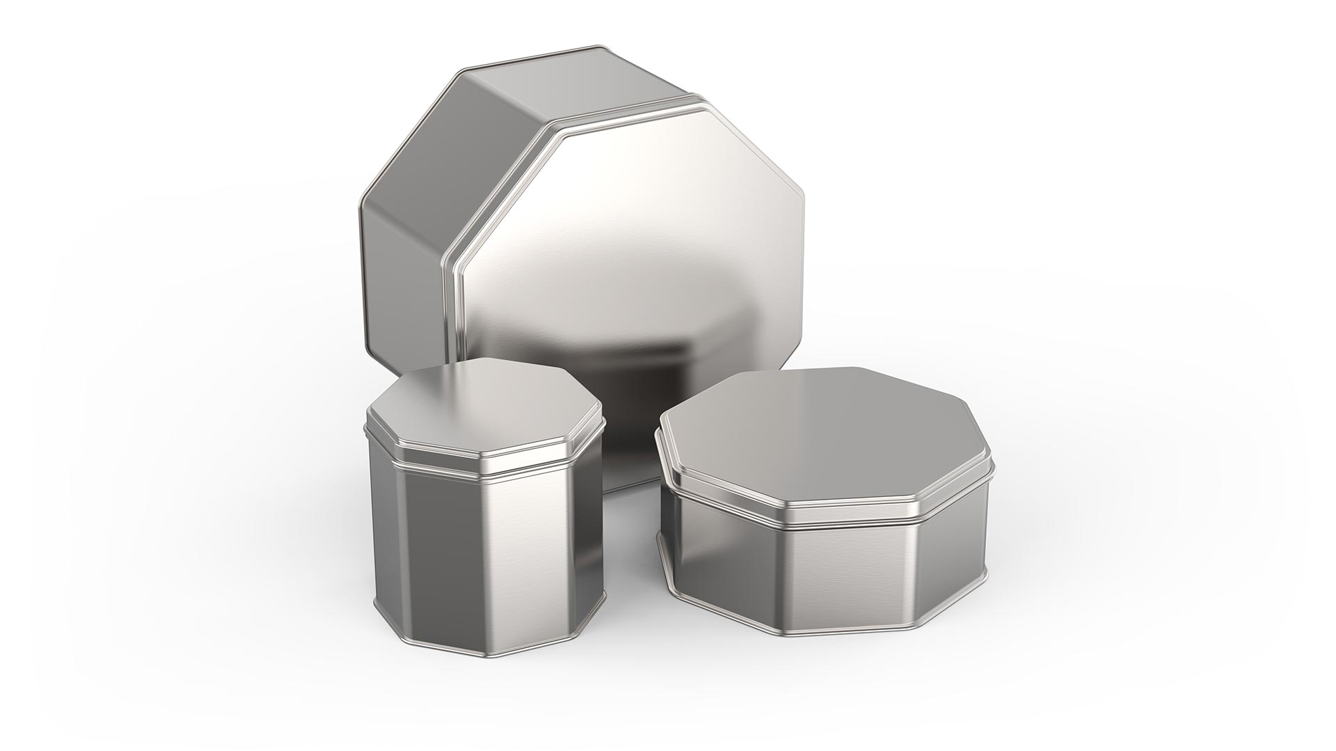 Three different octagon shaped silver tins stand next to each other.