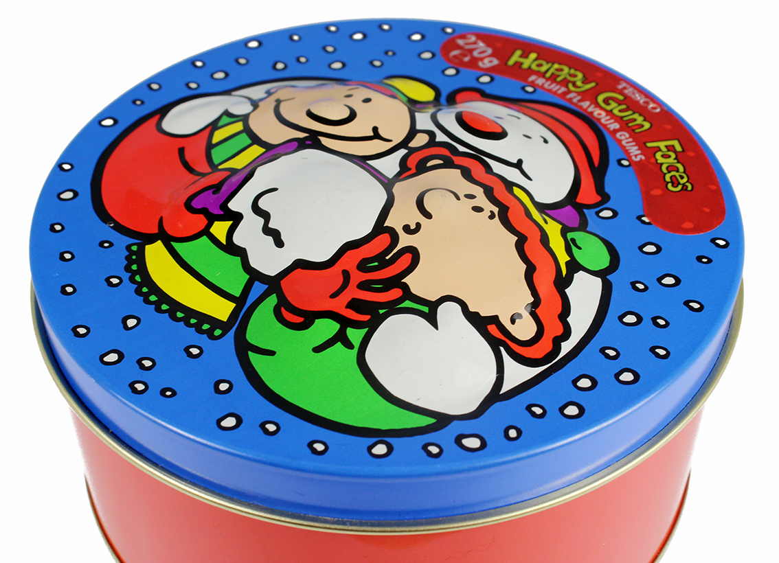 Bulge emboss 2.jpeg A winter holiday themed cookie tin with a bulge emboss applied to the middle of the lid.