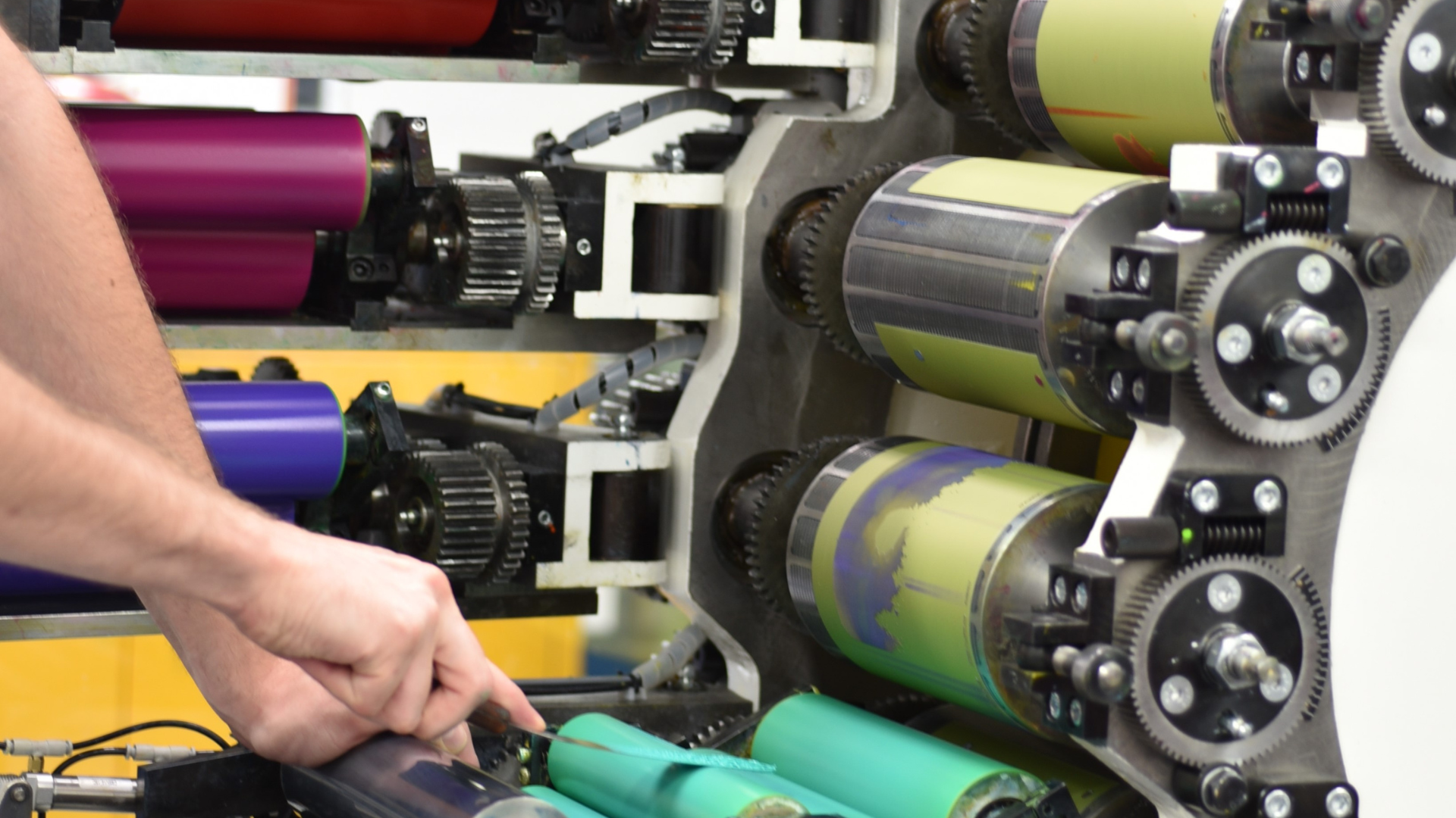Wet proofing station including various sized rollers in all different colors for mixing.