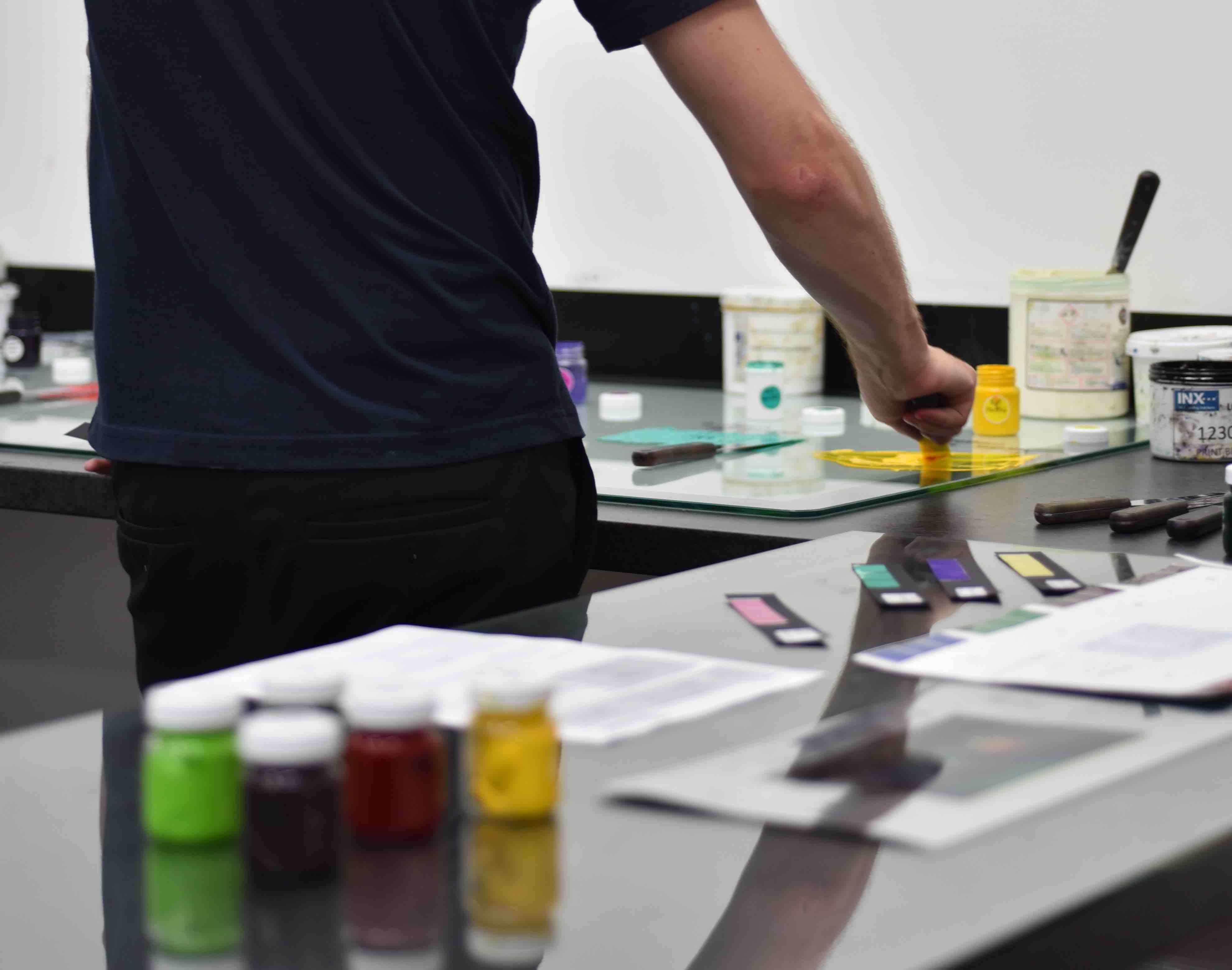 Person swatching various colors in a lab type setting