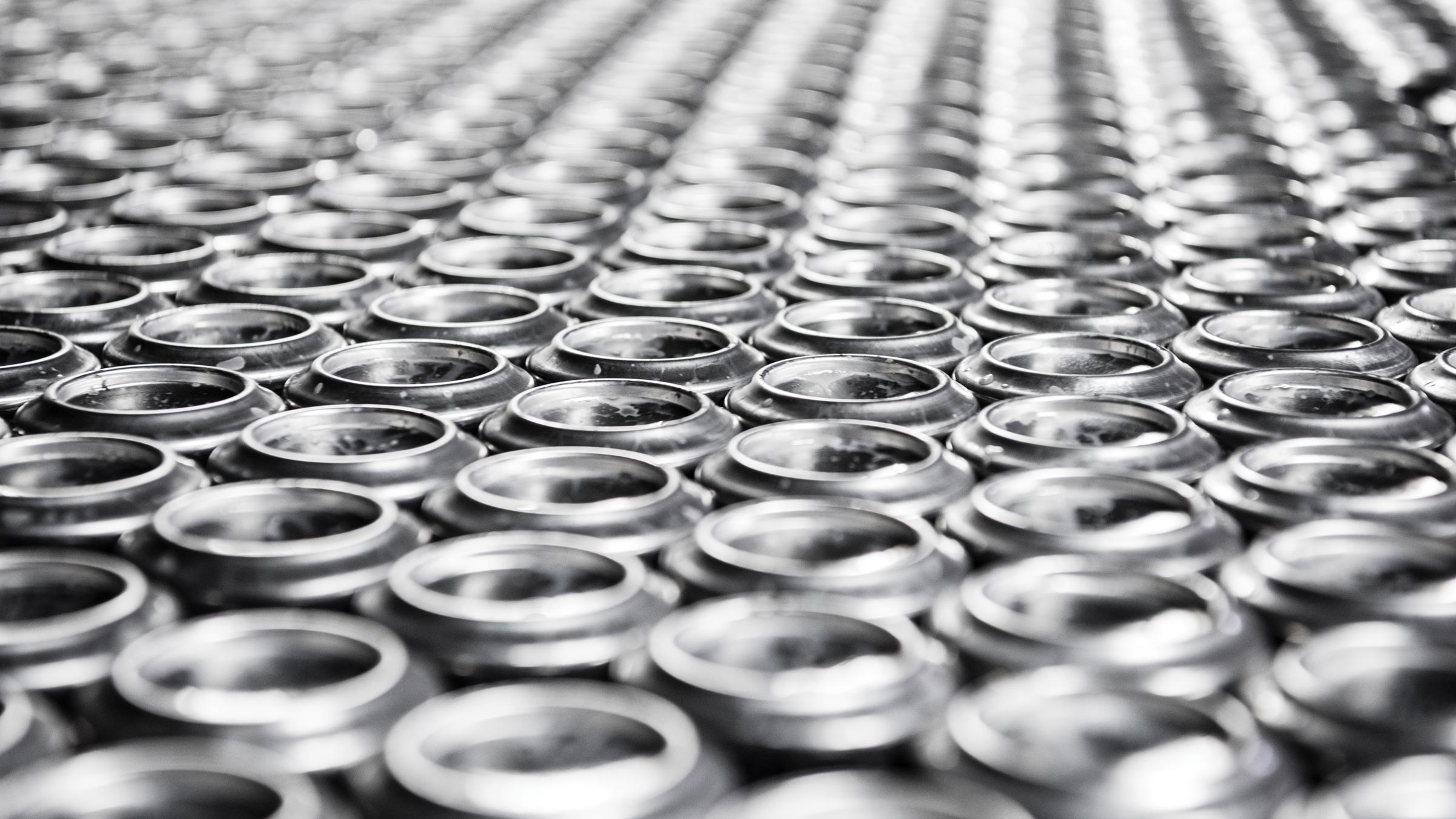 close up view of beverage cans in production