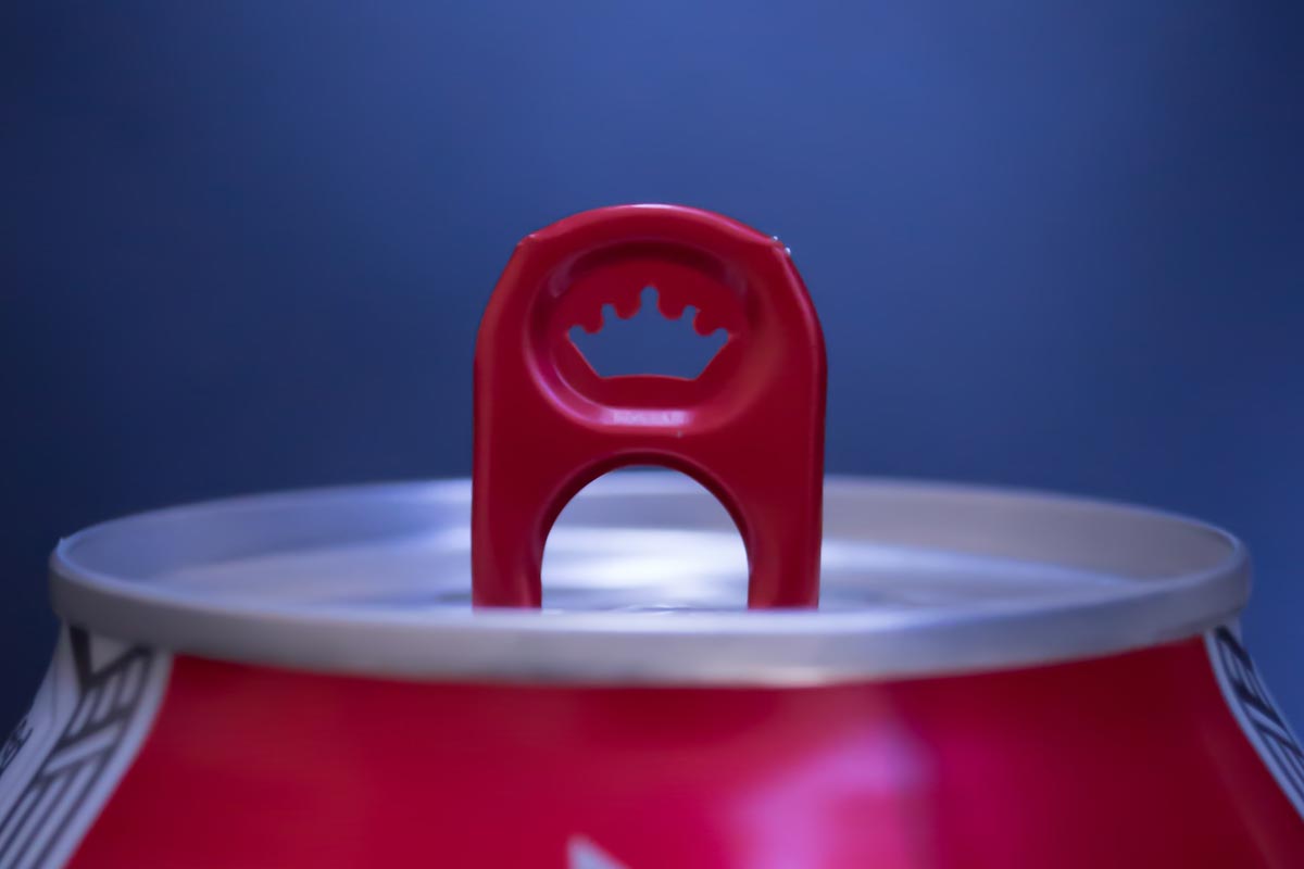side view of a beverage can showing a tab