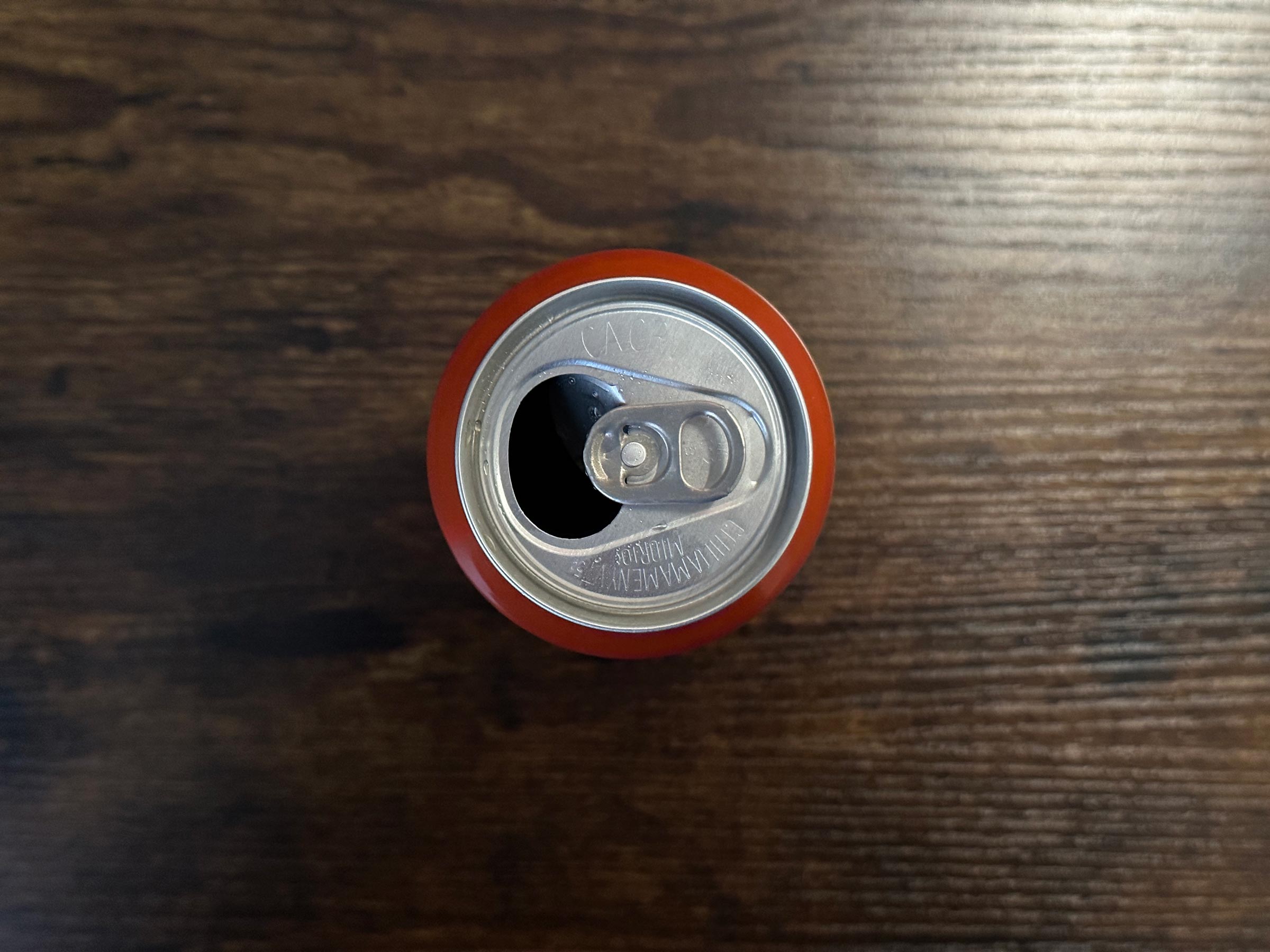 Crown beverage can sitting on a wooden table