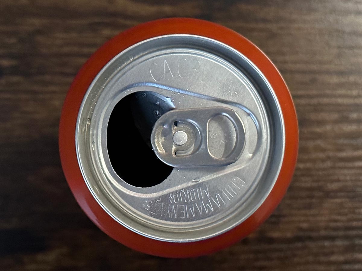 orange beverage can with a view of the end from above