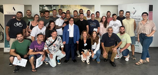 Many members of the Crown Cork Valencia team gather for a group photo.