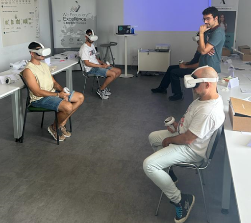 Four members of the Valencia team use VR while a proctor looks on.