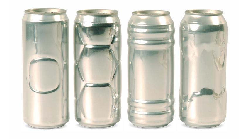 Four cans standing upright that have different cuttings and curves on each can.