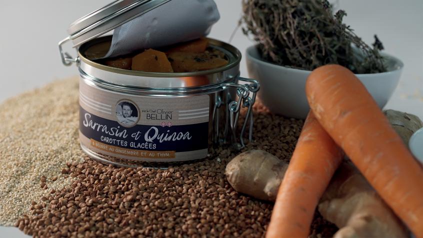 An opened can of quinoa sitting next to carrots and other vegetables