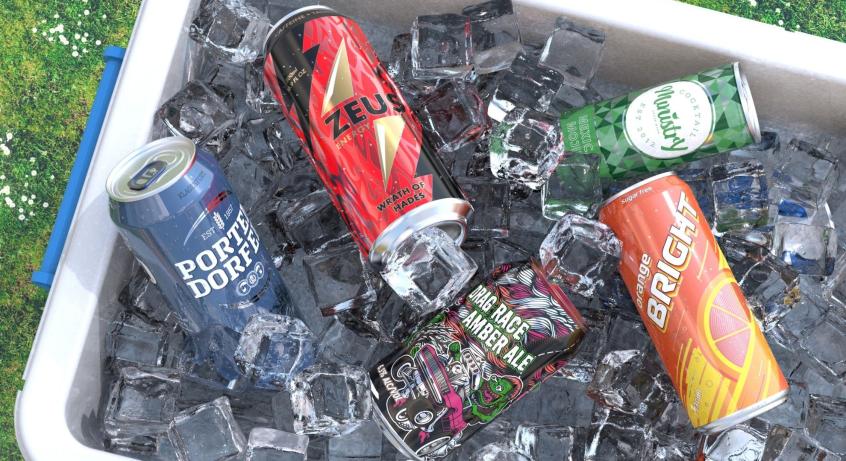 A variety of brightly decorated aluminum cans inside a blue cooler with ice