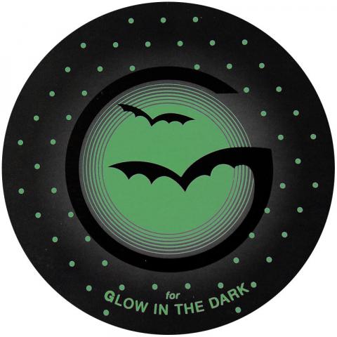 A depiction of a glow-in-the-dark finish, with a black capital "G" against a green background. The spur of the "G" has been designed to resemble the silhouette of a bat in flight!